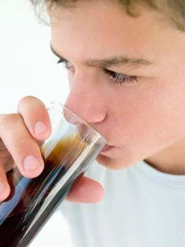 Young boy drinking soda Stock Photos