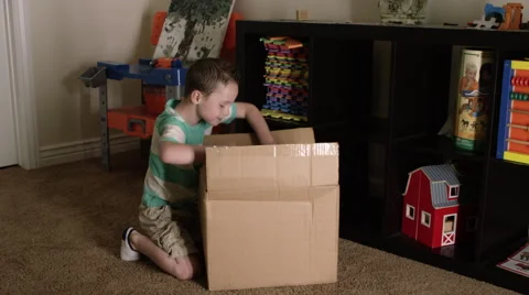 Young boy dumps blocks out of box Stock-Footage 62827800