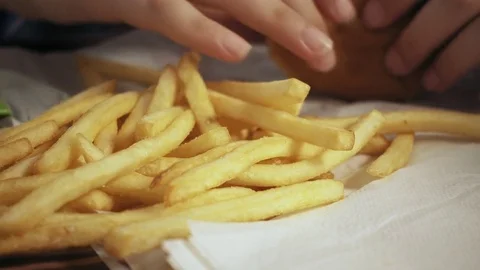 Young boy eating hamburger and french fries Stock Footage 84522211