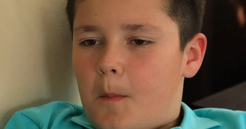 Young boy eating nuts 3 Stock Footage 89011507