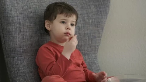 Young boy eating tomatoes Video stock 243384048