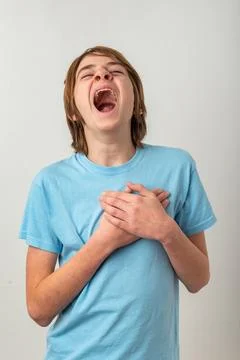 Young boy experiencing intense emotion, vocalizing loudly with an open mout.. Stock Photos