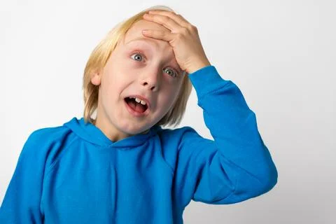 Young boy expressing forgetfulness or making a mistake, looking surprised w.. Stock-Fotos
