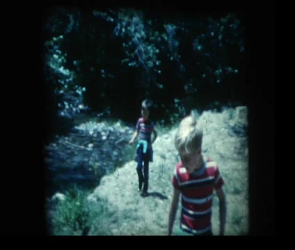 Young boy with fishing pole missing one shoe Stock Footage 33843527