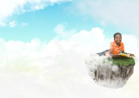 Young boy on floating rock platform  in sky reading book Stock Photos