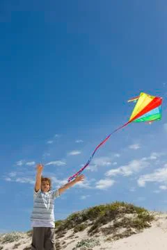 Young boy flying a kite Stock Photos