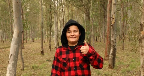 Young boy on forest hike looking at the camera and smiling 3 Stock Footage 121007963
