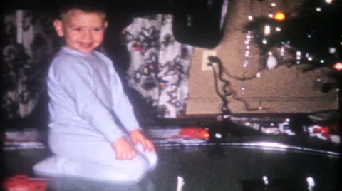 Young boy gets a model train for Christmas 1950s vintage film home movie 1567 Stock Footage 45532168