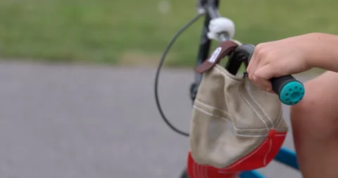 Young boy gets ready to ride bike in front of suburban house - bike begining  Stock Footage 219649999