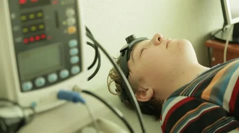 Young boy getting an electro-encephalogram Stock Footage 12553726