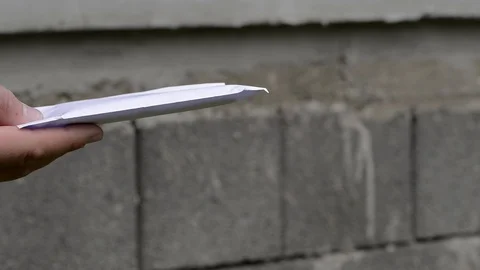 Young boy gives a white envelope with money Stock Footage 110501308