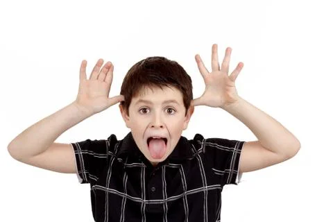 Young boy grimacing Stock Photos