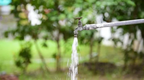 Young boy hand close the water from the old faucet in the garden. Stock Footage 64817286