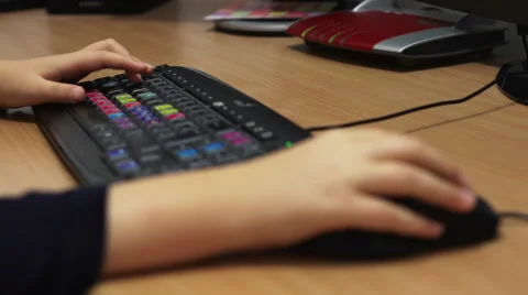 Young Boy Hand Working On Computer Keyboard Stock Footage 41341679