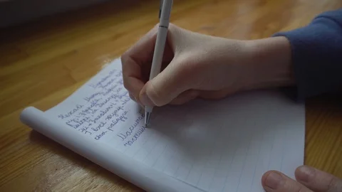 Young Boy Hand Writing on Paper Stock Footage 86569563