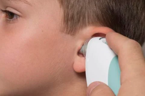 A young boy has his temperature taken Stock Photos