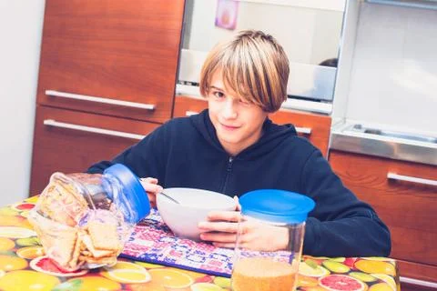 Young boy having breakfast before going to school New day of ordinary life Stock Photos