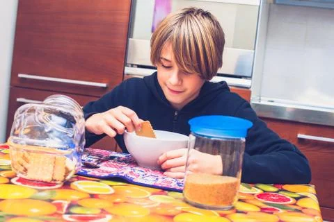 Young boy having breakfast before going to school New day of ordinary life Stock Photos