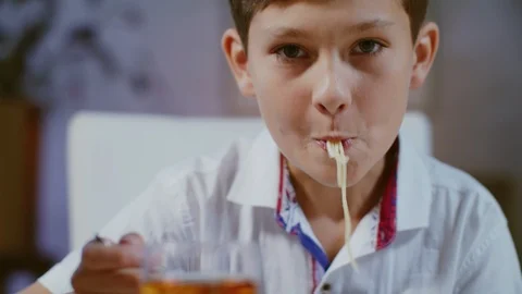 Young Boy Is Having Dinner. Pretty Pasta In The Plate. Close-up. Vídeos de archivo 118980812