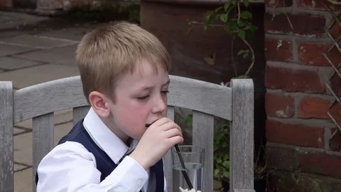 Young boy having a drink Stock Footage 91771281