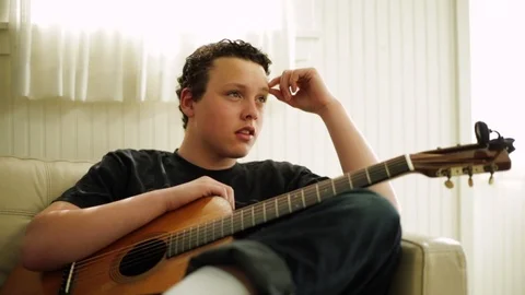 Young boy having fun playing with action figures. 스톡 동영상 88404496