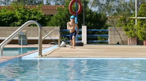 Young boy having fun at pool Stock Footage 58845821