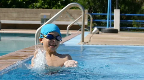 Young boy having fun at pool Stock Footage 58865610
