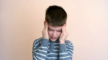 Young boy with headache Stock Footage 86080971