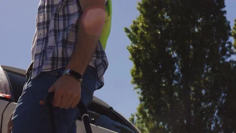 A young boy with his suitcase is ready to travel by car, Covid, 4K footage Stock Footage 155249061