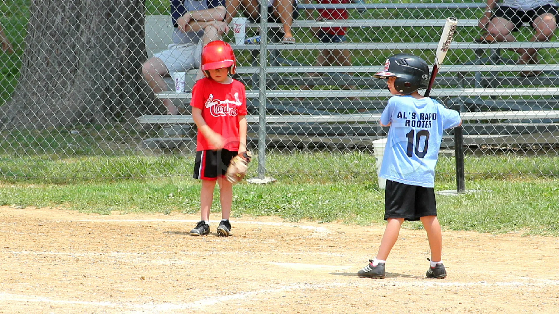 kid hitting baseball