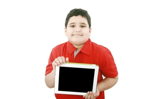 Young boy holding a tablet computer isolated on white Stock Photos
