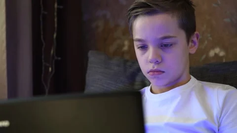 Young boy at home with laptop Stock Footage 152168979