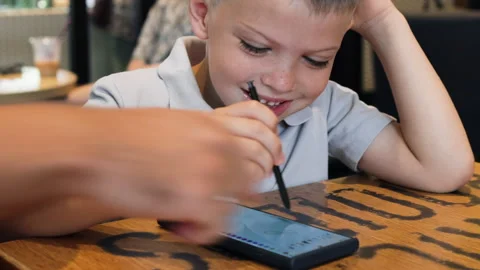 Young boy immerses himself in creativity. Stock Footage 288978464