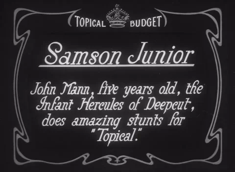 Young boy John Mann showing of tremendous strength, United Kingdom, 1925 Stock Footage 172219497