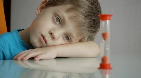 Young boy laying his hand on his arm Video stock 61386059