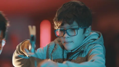 Young boy learning carpentry skills with hammer Stock Footage 329545213