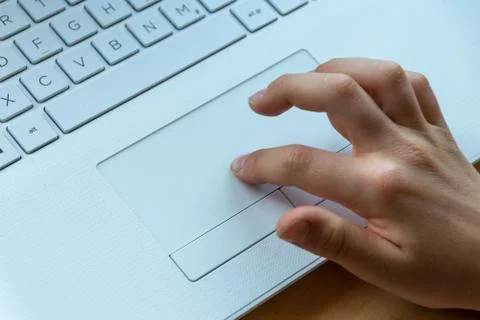 Young boy is learning to code and program at a white notebook Stock Photos
