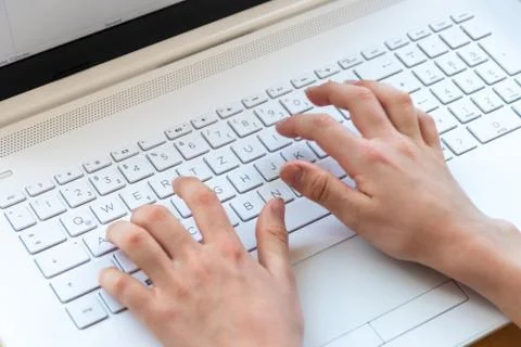 Young boy is learning to code and program at a white notebook Stock Photos