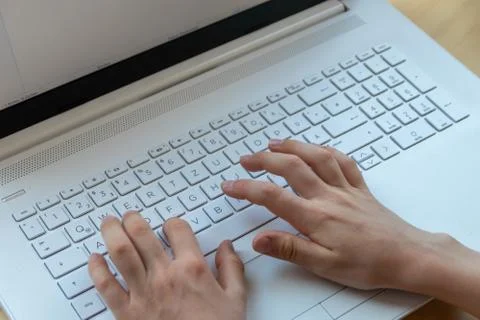 Young boy is learning to code and program at a white notebook Stock Photos