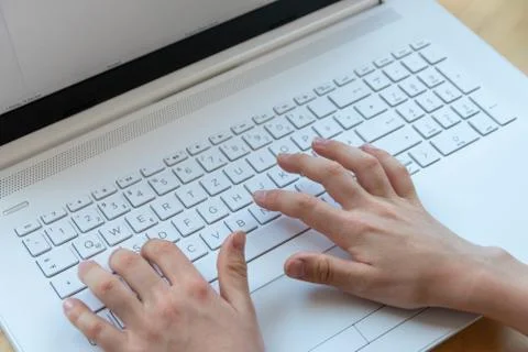 Young boy is learning to code and program at a white notebook Foto stock
