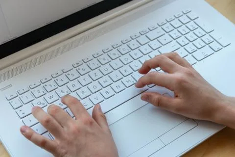 Young boy is learning to code and program at a white notebook Photos
