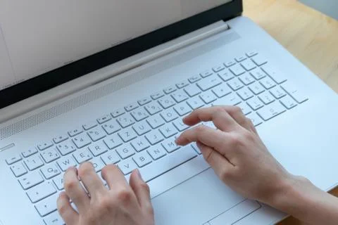 Young boy is learning to code and program at a white notebook Photos