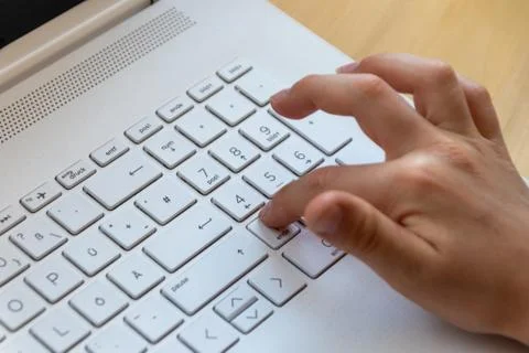Young boy is learning to code and program at a white notebook Photos