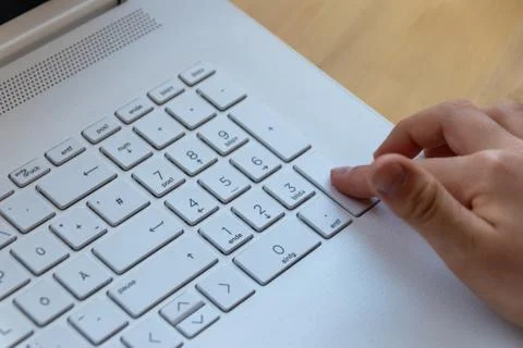 Young boy is learning to code and program at a white notebook Foto stock