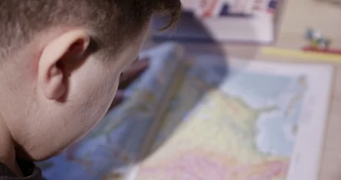 Young boy learns geography Stock-Footage 106756322