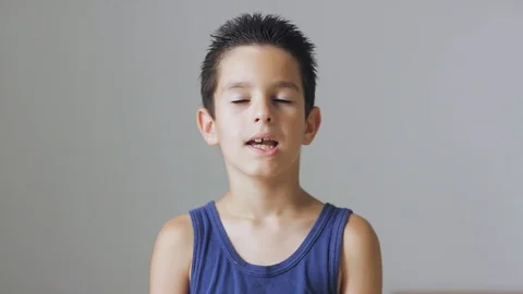 Young boy looking and talking to camera. Stock Footage 111971751