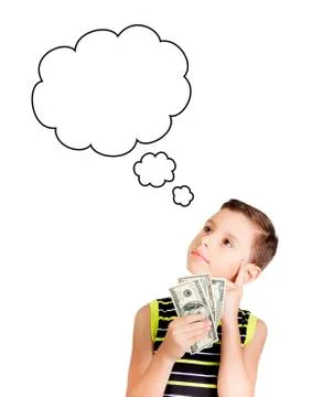 Young boy looking up and thinking what to buy with his money Stock Photos
