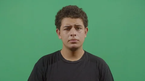 Young boy looking at camera with suspicion like something strange is happening Stock Footage 115337599