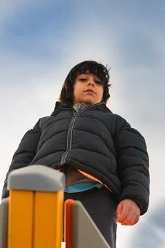 Young boy looking directly at camera with serious expression Stock Photos