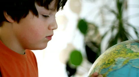 Young boy looking at the globe Stock Footage 863623